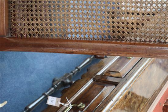 A George III mahogany Bergere with leather squab